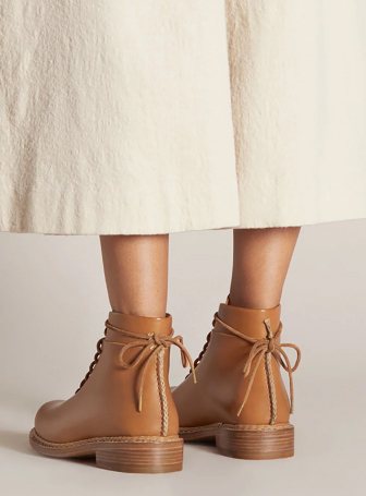 Person wearing brown boots